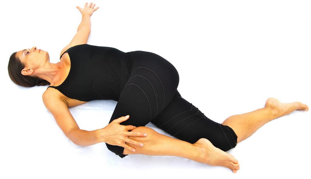Parivrtta-supta-padangusthasana-variation-reverse-reclined-big-toe-pose-variation-with-2-knees-bent-Opale-Yoga-Ibiza.jpg